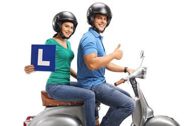 picture of two young people on a motor scooter